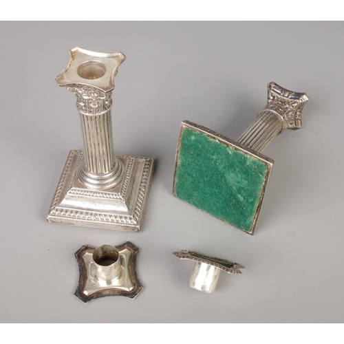 469 - A pair of Victoria Corinthian column silver candlesticks, with sconce inserts, hallmarks 