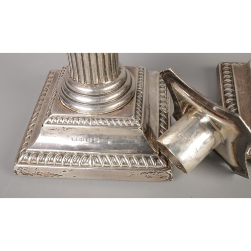 469 - A pair of Victoria Corinthian column silver candlesticks, with sconce inserts, hallmarks 