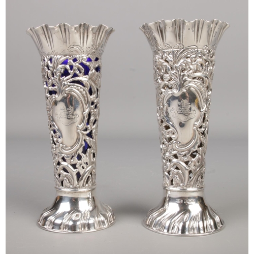 485 - A pair of Victorian James Dixon and Sons silver specimen vases featuring Bristol blue glass liners, ... 