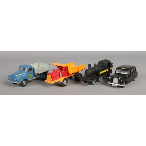 493 - Four Budgie die-cast vehicles; consisting of No. 224 Railway Engine (boxed), No. 101 London Taxi Cab... 