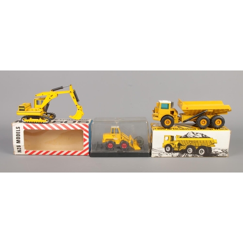 496 - Three NZG die-cast construction vehicles, two with cardboard boxes. No. 166 D300 Articulated Dump Tr... 