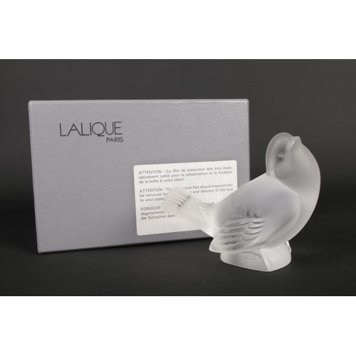 512 - A Lalique frosted glass bird signed to base - 10cm high. In original box.