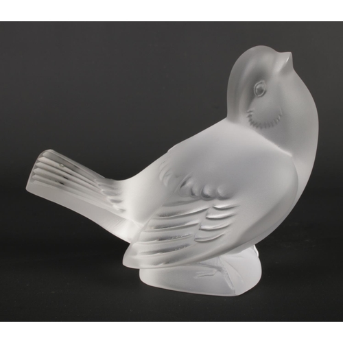 512 - A Lalique frosted glass bird signed to base - 10cm high. In original box.