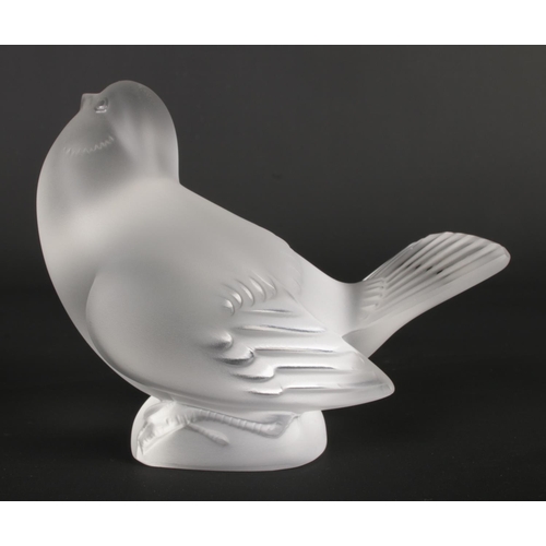 512 - A Lalique frosted glass bird signed to base - 10cm high. In original box.