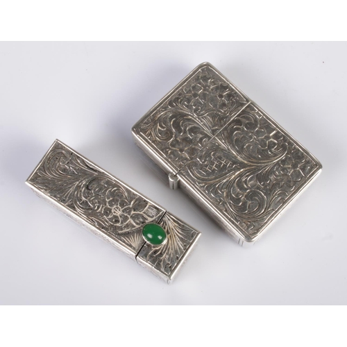 516 - An early 20th century Continental silver lipstick case along with a similar lighter. The lipstick ca... 