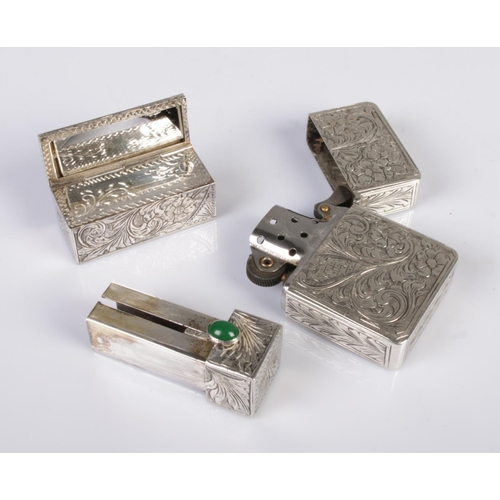 516 - An early 20th century Continental silver lipstick case along with a similar lighter. The lipstick ca... 