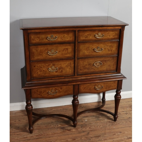 522 - A Willis and Gambier walnut chest on stand.