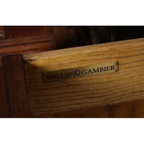 522 - A Willis and Gambier walnut chest on stand.