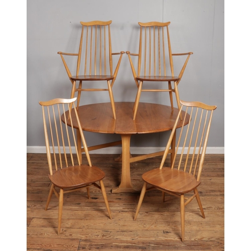 528 - An Ercol light Sutherland style dining table, together with four Ercol Blonde Elm 'Goldsmith' chairs... 