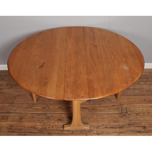 528 - An Ercol light Sutherland style dining table, together with four Ercol Blonde Elm 'Goldsmith' chairs... 