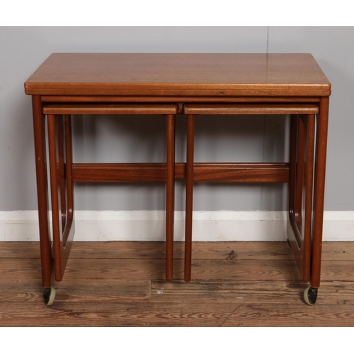 529 - A mid-century McIntosh Triform nest of three tables; the largest having folding and revolving top. R... 