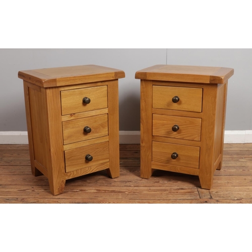 538 - A pair of oak bedside chests.