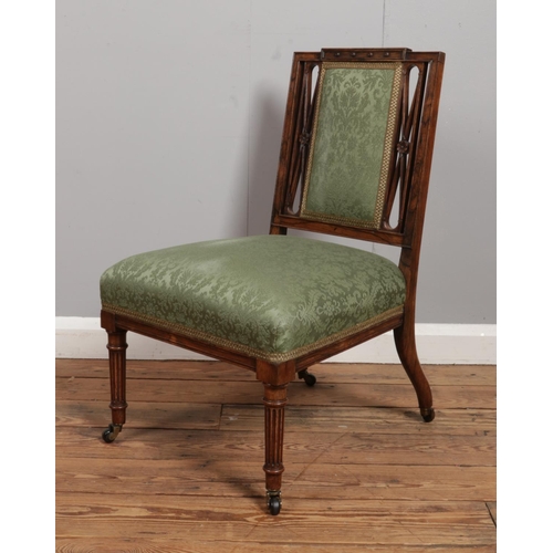 539 - A small Nineteenth Century rosewood chair, with twin pierced X-frame splat, upholstered seat and bac... 