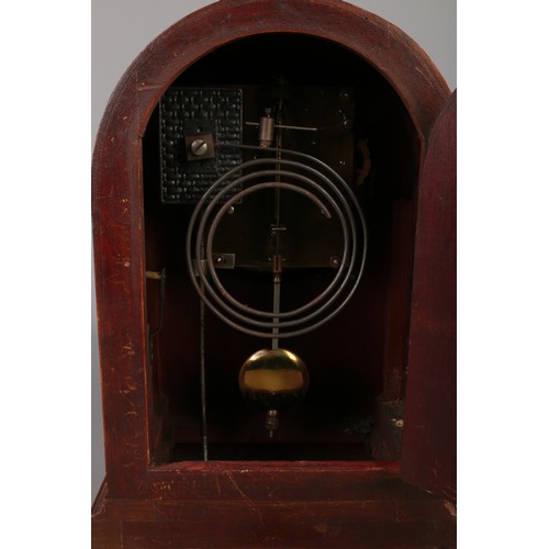 169 - A mahogany German Badische Uhrenfabrik dome top mantel clock featuring banded inlay.