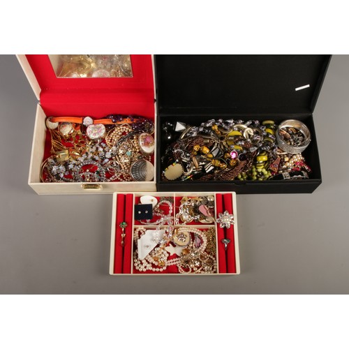 240 - Two jewellery boxes containing a collection of costume jewellery, including dress rings, beaded neck... 