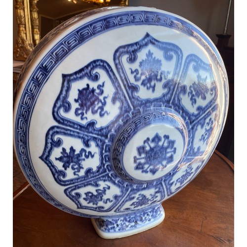 11 - A Bajixiang blue and white moon flask, bearing Kangxi reign marks to base. Height 41cm.