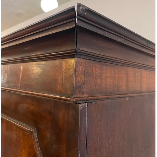 155 - A Georgian mahogany linen press. Having moulded and inlaid doors over drawer base. Height 204cm, Wid... 