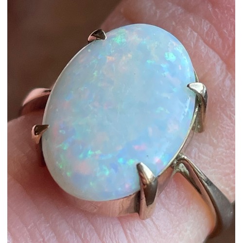 426 - A 9ct gold ring set with large opal cabochon stone. Size M, 2.6g. Opal approximately 1.5cm x 1cm.