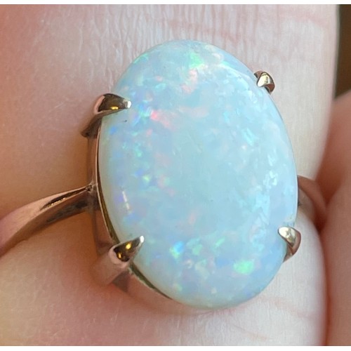 426 - A 9ct gold ring set with large opal cabochon stone. Size M, 2.6g. Opal approximately 1.5cm x 1cm.