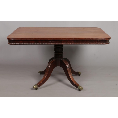 675 - A Regency mahogany tilt top breakfast table. Table top 126cm x 89cm.