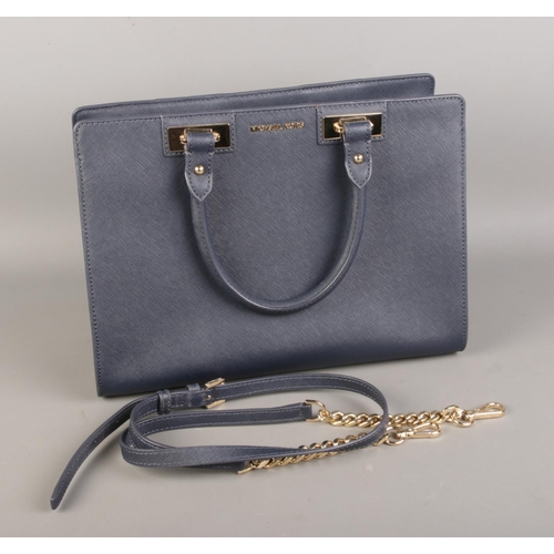 20 - A blue Michael Kors navy leather satchel with dust cover.