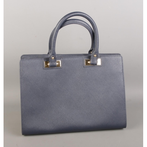 20 - A blue Michael Kors navy leather satchel with dust cover.