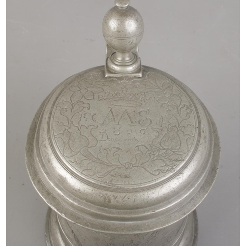 3 - An 18th century Bohemian pewter quart tankard. Decorated with floral engraving, ball finial thumbpie... 