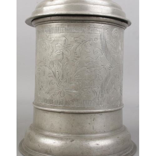 3 - An 18th century Bohemian pewter quart tankard. Decorated with floral engraving, ball finial thumbpie... 