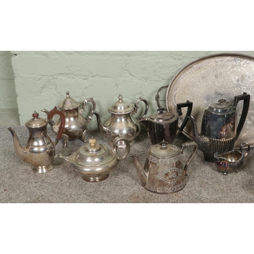 363 - A substantial collection of vintage silver-plated items, primarily featuring tea sets, teapots and c... 