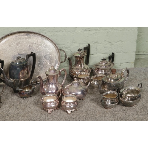 363 - A substantial collection of vintage silver-plated items, primarily featuring tea sets, teapots and c... 