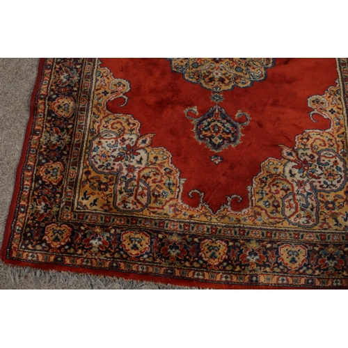 392 - A floor rug with red floral design 

186x132cm