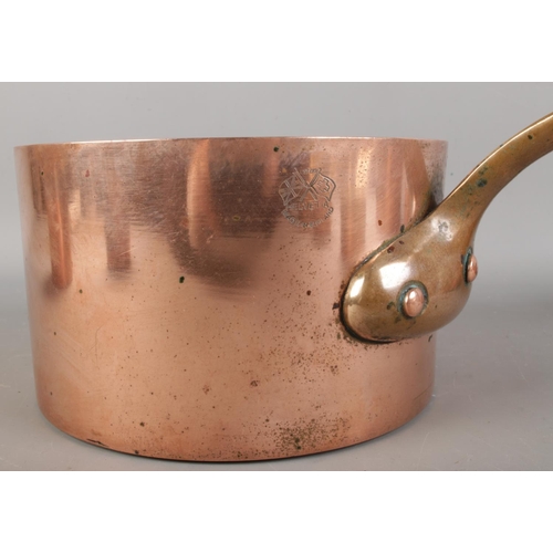 395 - A collection of antique copper pans, in various sizes, some bearing marks such as 