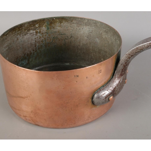 395 - A collection of antique copper pans, in various sizes, some bearing marks such as 