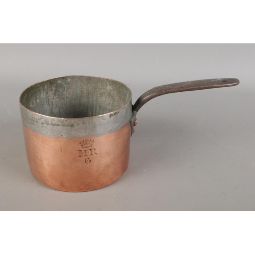 395 - A collection of antique copper pans, in various sizes, some bearing marks such as 