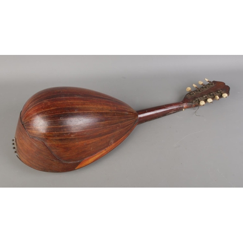 417 - An antique Stella bowlback mandolin.