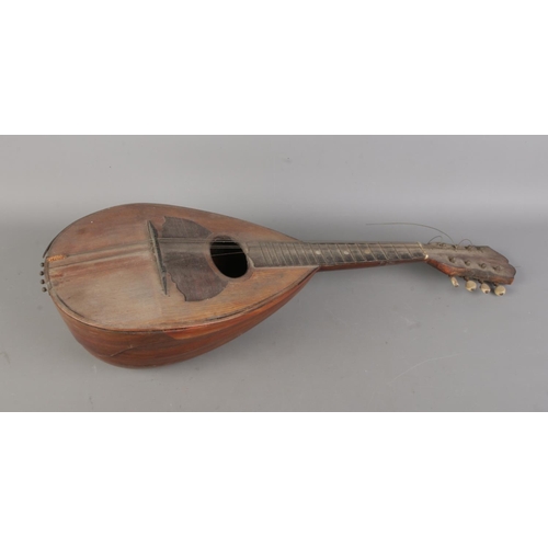 417 - An antique Stella bowlback mandolin.