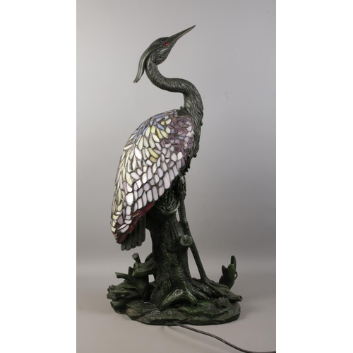 5 - A large Tiffany style table lamp formed as a heron on naturalistic base. Bearing label to the base f... 