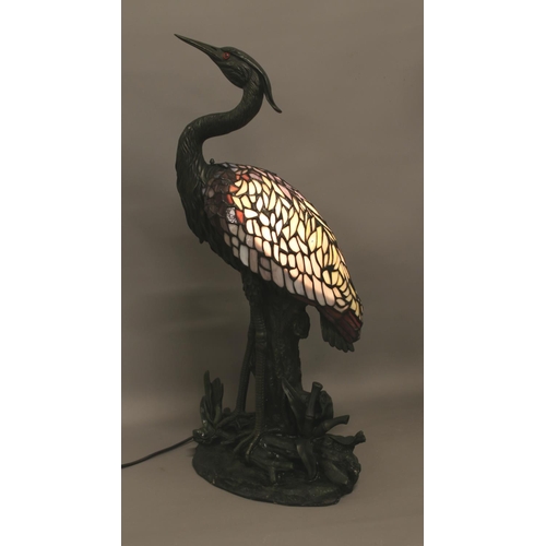 5 - A large Tiffany style table lamp formed as a heron on naturalistic base. Bearing label to the base f... 