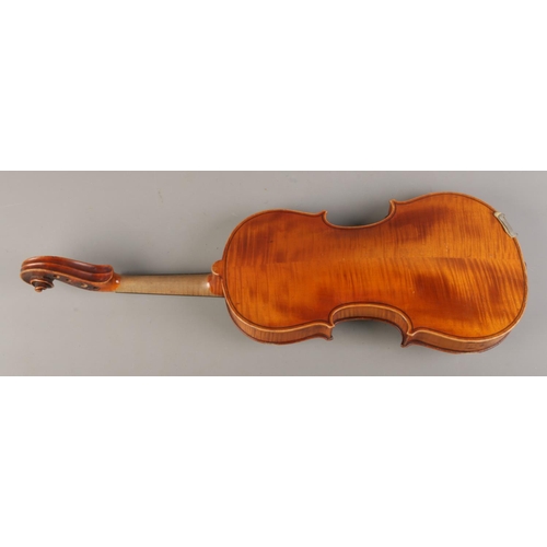 56 - An early Twentieth century cased violin with two piece back, for restoration. Label inside for Wolff... 