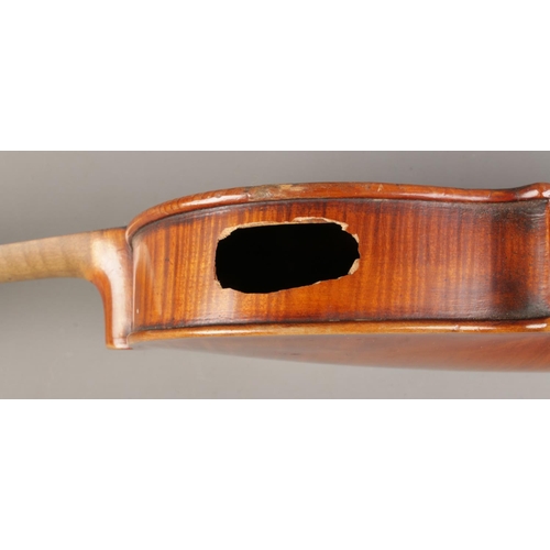 56 - An early Twentieth century cased violin with two piece back, for restoration. Label inside for Wolff... 