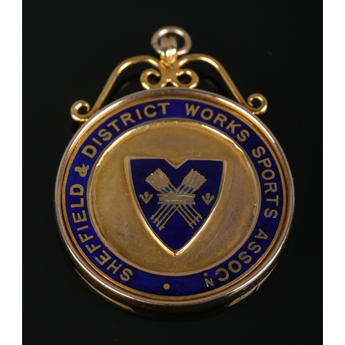 510 - A 9ct Gold fob from the Sheffield & District Works Sports Association, with inscription to the rever... 