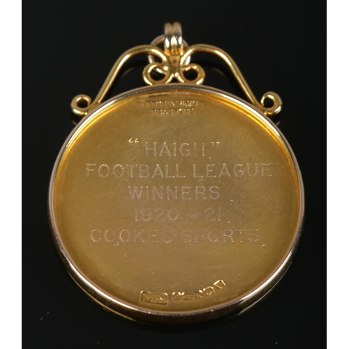 510 - A 9ct Gold fob from the Sheffield & District Works Sports Association, with inscription to the rever... 