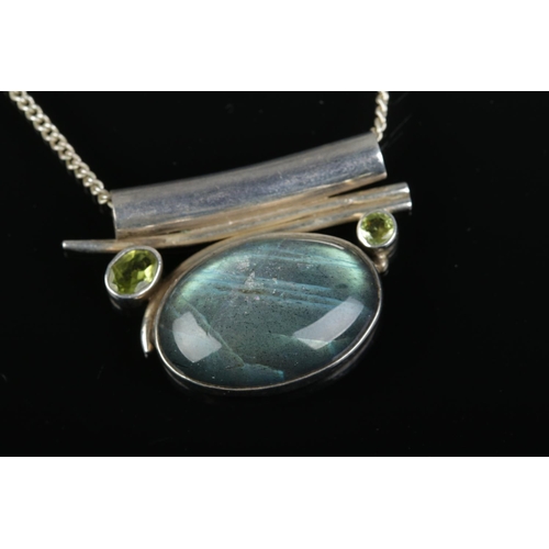 522 - A Labradorite pendant on silver chain together with matching ring