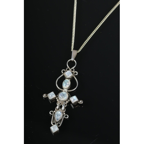 524 - A mid century silver and moonstone pendant on chain.