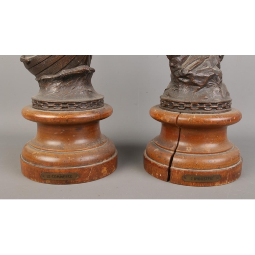 62 - A pair of French spelter figures, raised on turned bases. Titled 'Le Commerce' and 'L'Industrie'. He... 