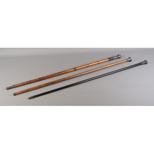 64 - Three walking sticks, to include bamboo four piece anglers rod and two silver topped examples. Exten... 