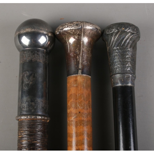 64 - Three walking sticks, to include bamboo four piece anglers rod and two silver topped examples. Exten... 