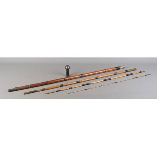 64 - Three walking sticks, to include bamboo four piece anglers rod and two silver topped examples. Exten... 