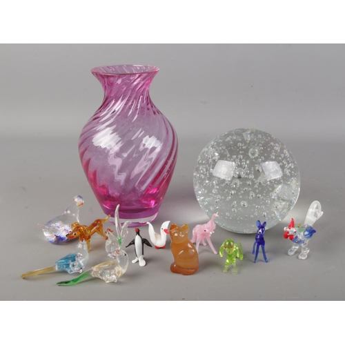 65 - A quantity of mostly glass collectables. Includes coloured glass vase, animal figures and a controll... 