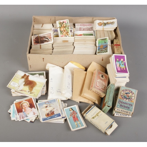 66 - A large quantity of cigarette cards with albums, including two complete albums, six empty albums and... 